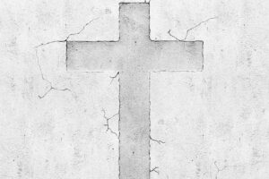 Blank concrete grey wall background with cross symbol