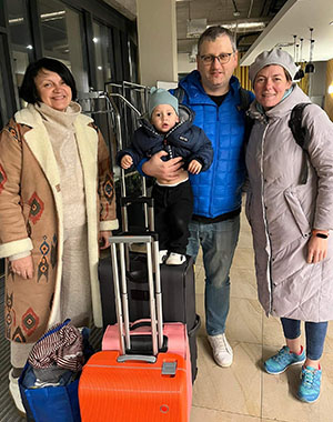 Tetiana Kritenko (left) helps a Ukrainian family make aliyah.