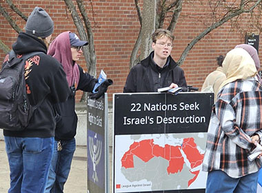 Keegan (center) discussing Israel on campus.