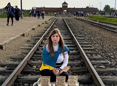 Margarita in front of the Auschwitz-Birkenau concentration camp