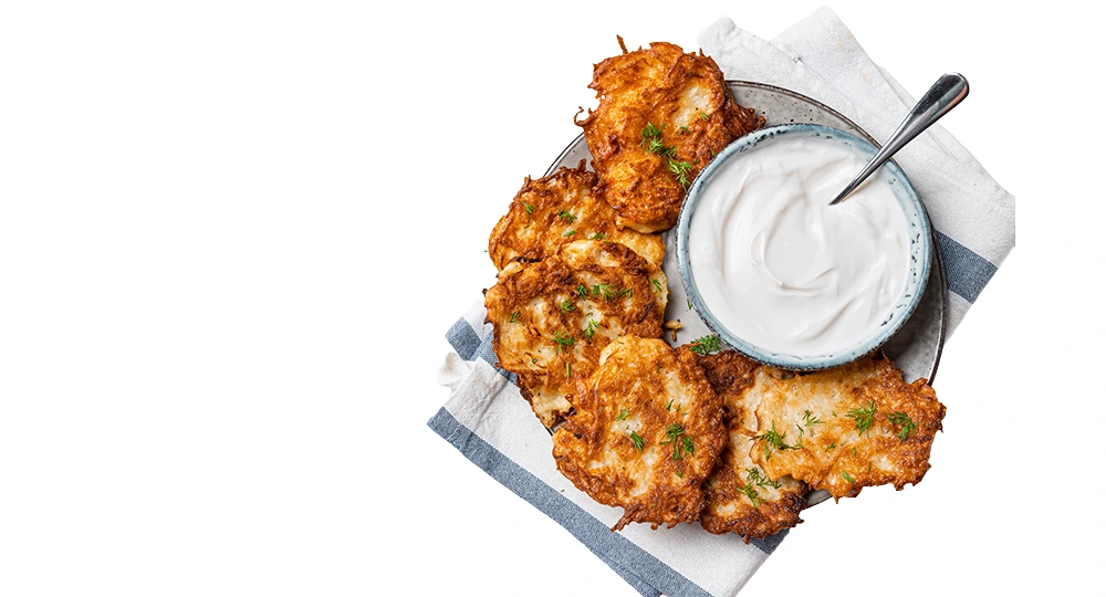 Potato latkes frying in oil